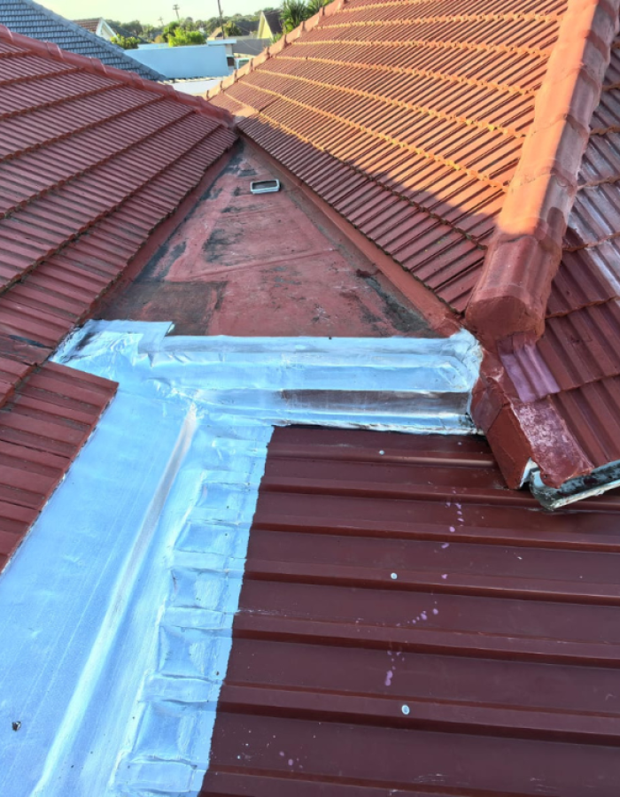 Rusted roof sheets replaced with new colour bond ultra roof sheets and waterproofed using torch on membrane,silver aluminum coating applied onto torch on membrane.